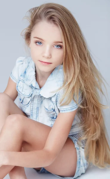 Beautiful little girl on grey background — Stock Photo, Image