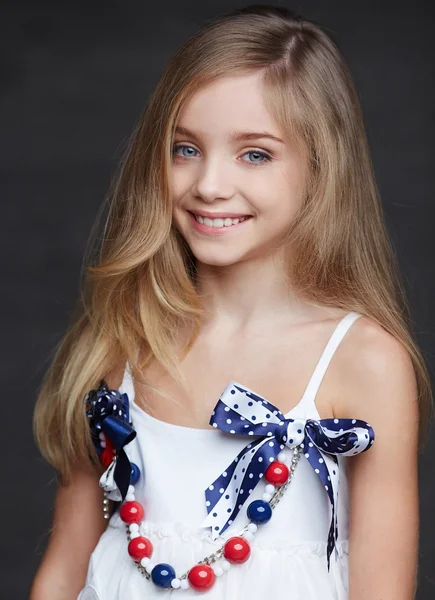 Happy young girl in a dress with long hair — Stock Photo, Image