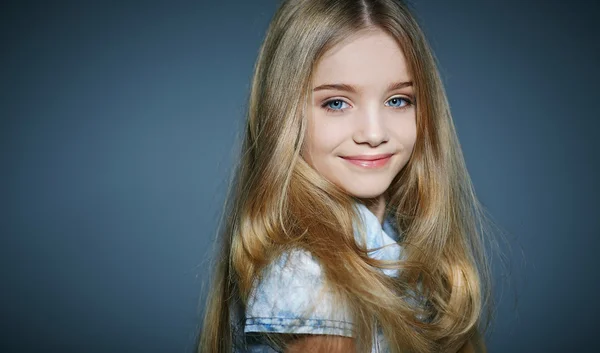 Beautiful little girl on grey background — Stock Photo, Image