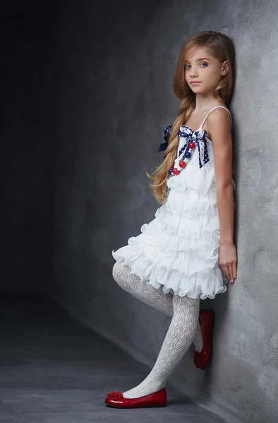 Yaoung girl in white dress and red shoes — Stock Photo, Image