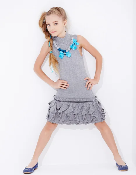 Cute little girl in a dress posing — Stock Photo, Image