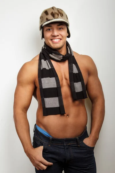 Smiling guy in hat and scarf — Stock Photo, Image