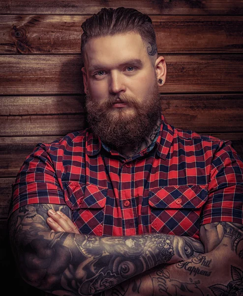 Brutal man with tattooes and beard — Stock Photo, Image