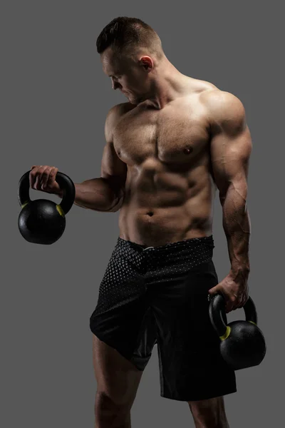 Awesome muscular guy with dumbell — Stock Photo, Image