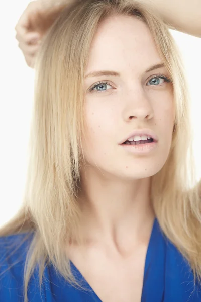 Portrait of young woman in blue dress — Stock Photo, Image