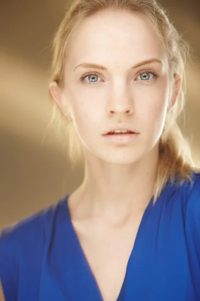 Portrait of young woman in blue dress — Stock Photo, Image