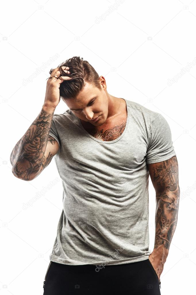 Muscular man posing on white background