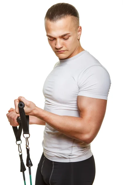 Fitness man doing exercises with expander — Stock Photo, Image