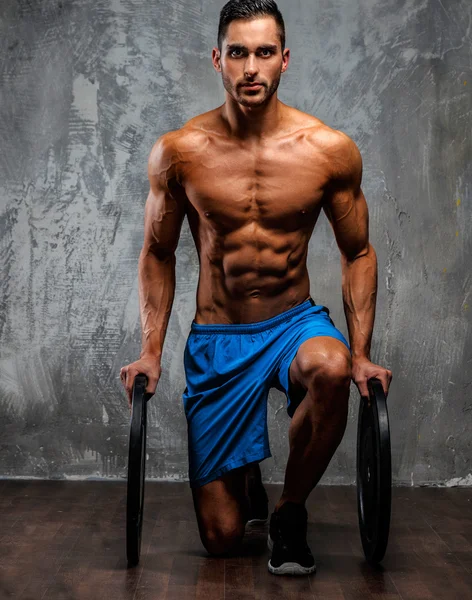 Muscular guy in blue shorts — Stock Photo, Image