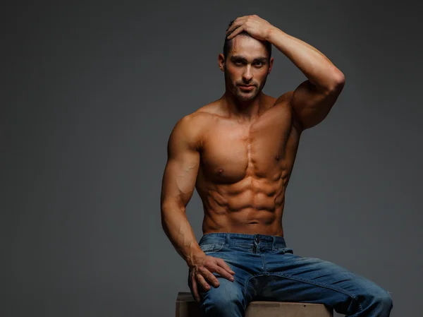 Attractive shirtless guy in blue jeans — Stock Photo, Image