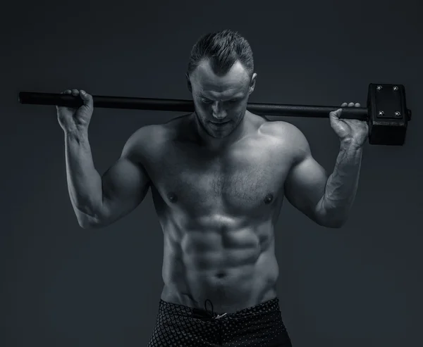 Shirtless muscular man with hummer — Stock Photo, Image