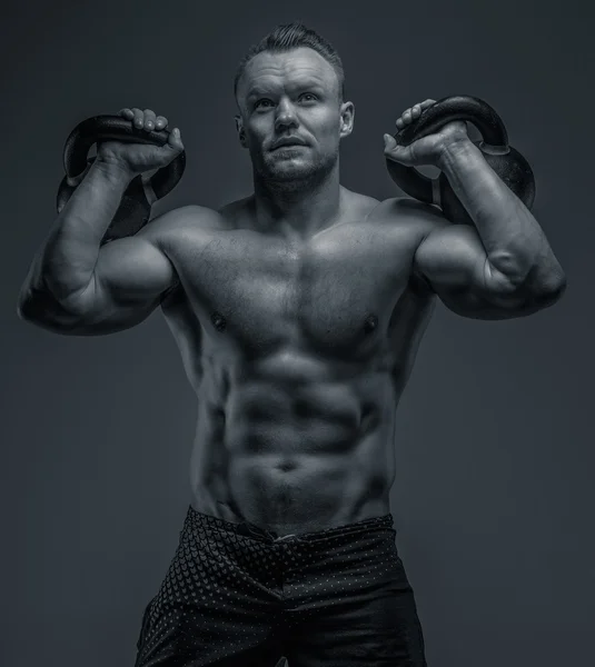 Muscular guy in black shorts — Stock Photo, Image