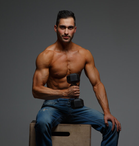 Shirtless fitness man in blue jeans