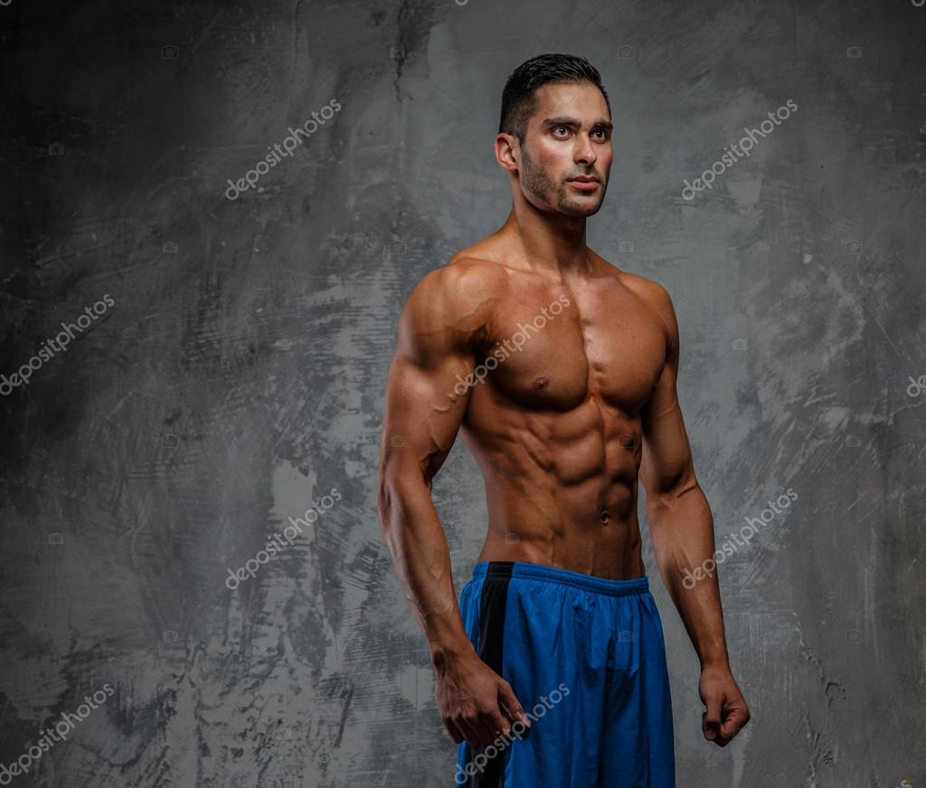 Muscular shirtless fitness man Stock Photo by ©fxquadro 73074057