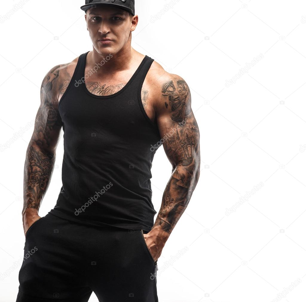 Modern muscular guy with tattooes