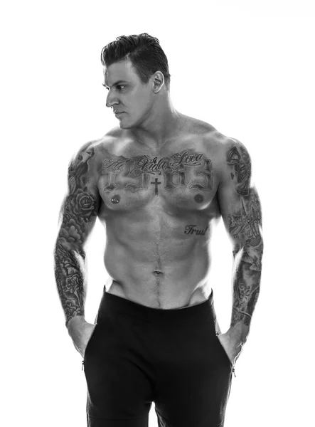 Tattoed muscular man — Stock Photo, Image