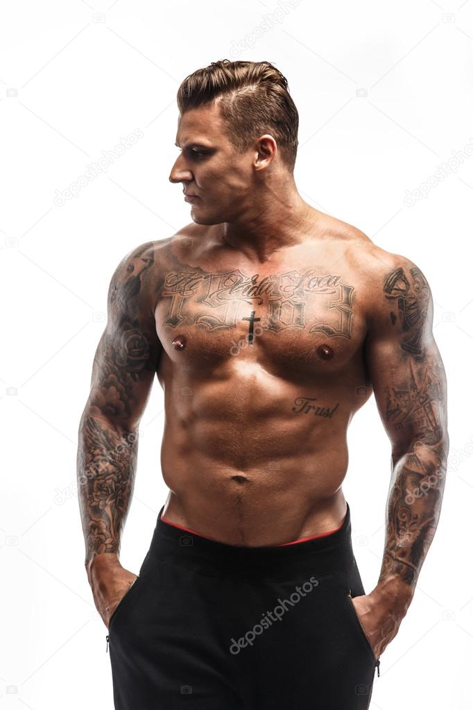 Awesome muscular man with tattoo