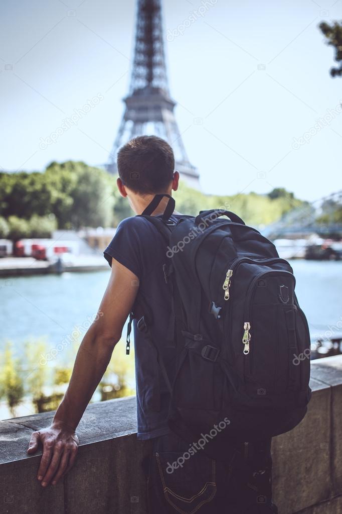 Tourist on the bridge near eiffel tower.