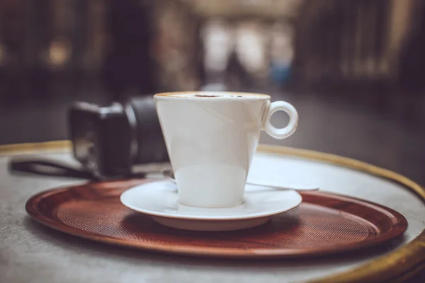 A cup of coffee on brown tray. — Stock Photo, Image