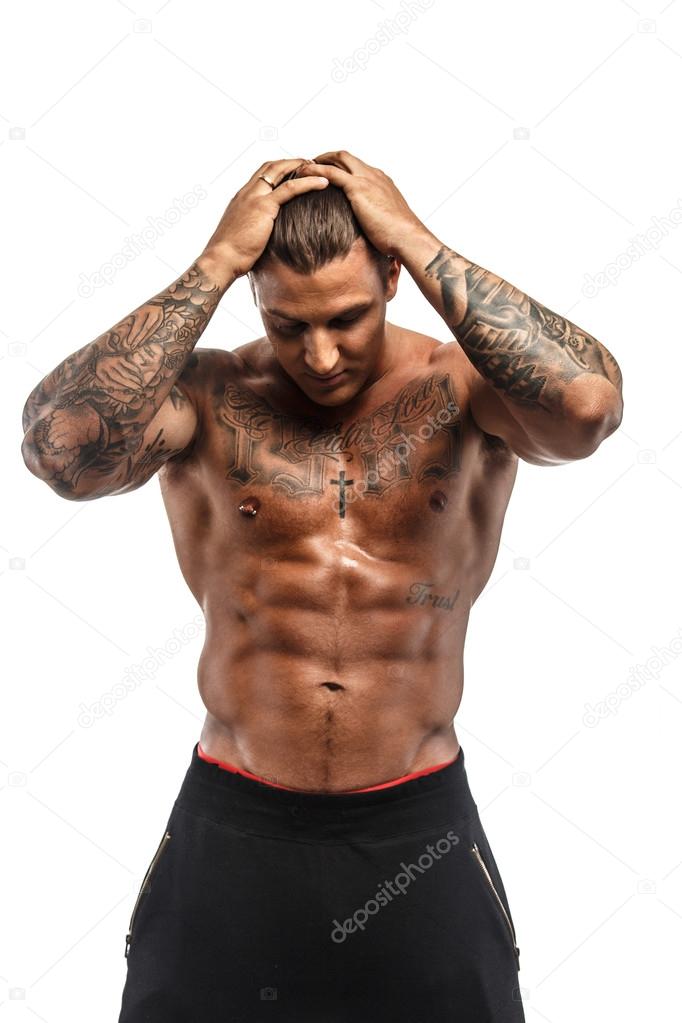 Shirtless muscular man with tattoos 