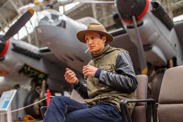 Funny man in airplanes museum. — Stock Photo, Image