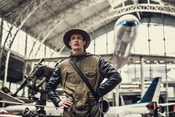 Funny man in airplanes museum. — Stock Photo, Image