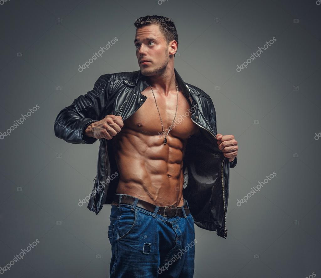 Bodybuilder in blue jeans and black jacket. Stock Photo by ©fxquadro ...