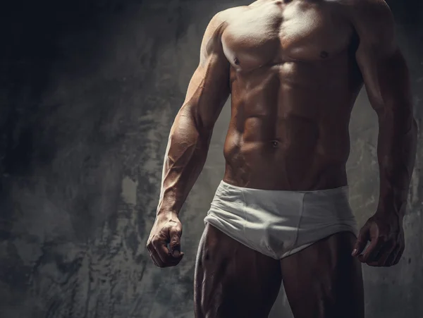 Muscular guy in white panties Stock Picture