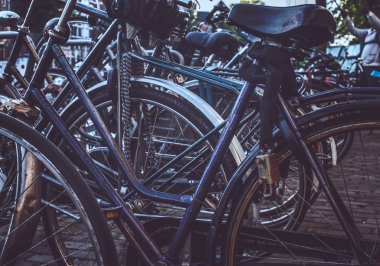 A lot of bicycles with wheels