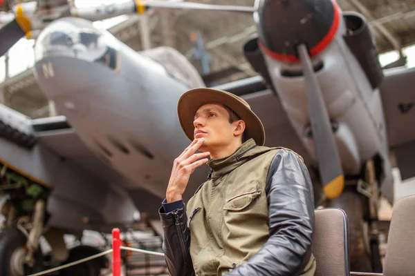 Man in hat on airplanes exhebition. — Stok fotoğraf