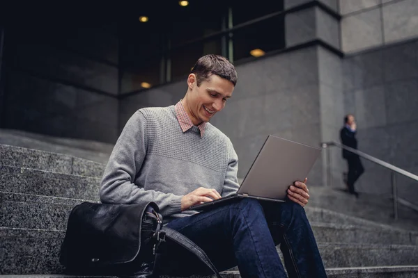 Guy sitting on steps — Stock Photo, Image