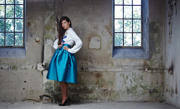 Woman in blue skirt and white jacket — Stock Fotó