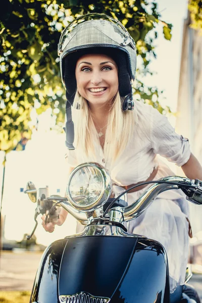 Smiling young blond female in white dress — Stock Photo, Image