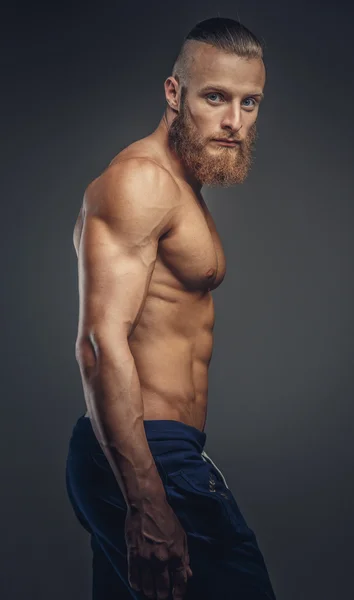 Shirtless muscular bodybuilder with beard — Stock Photo, Image