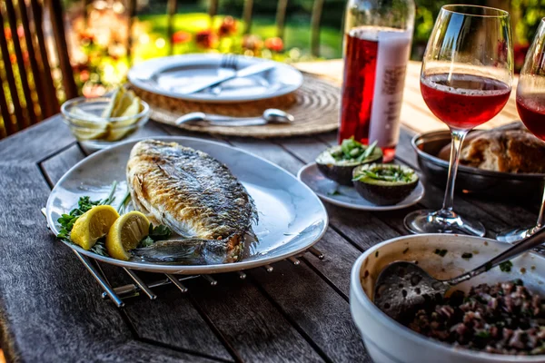 Grilled fish on white plate. — Stock Photo, Image