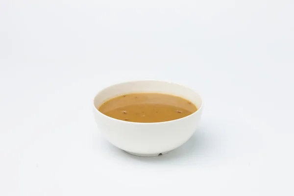 Yellow cream soup in white cup. — Stock Photo, Image