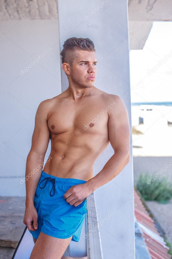 Muscular shirtless male model.