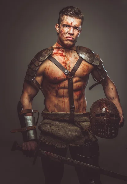 Bloody gladiator in armor. — Stock Photo, Image