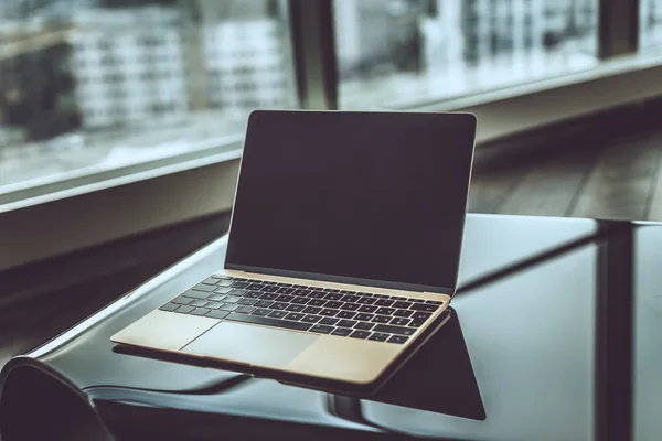 Silver laptop on table. — Stock Photo, Image