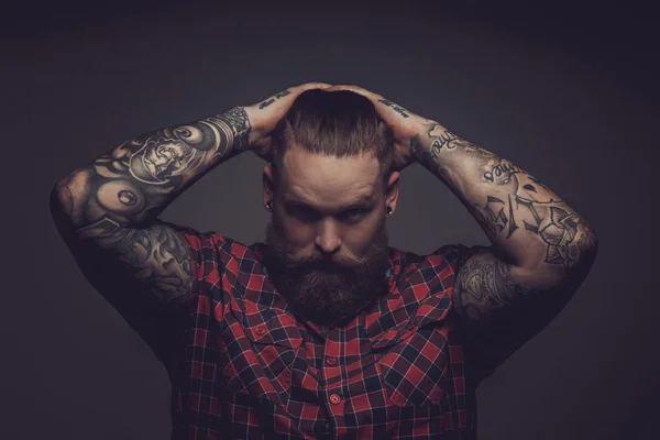 Brutal guy with beard and tattooes. — Stock Photo, Image