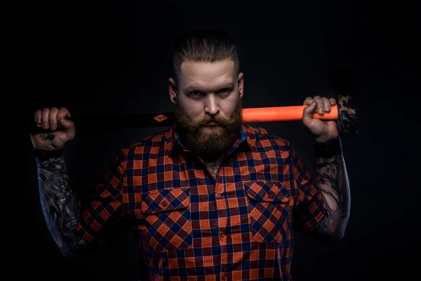 Serious man with beard and tattooes. — Stock Photo, Image