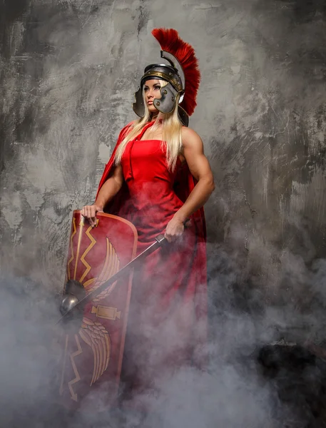 Blong roman woman in red dress. — Stock Photo, Image