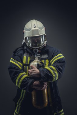 Firefighter in helmet and mask clipart