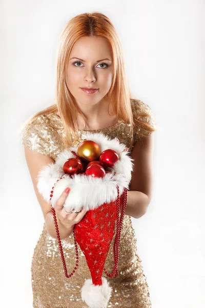 Redhead woman in golden dress. — Stock Photo, Image