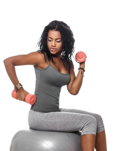 Side view of wooman sitting on fitness ball. — Stock Photo, Image