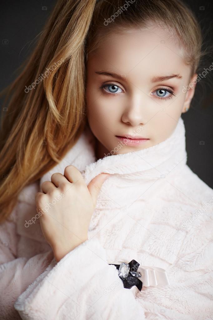 Portrait of cute blond girl. 