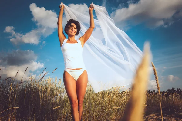 Middle age woman in white bikini. — Stock Photo, Image