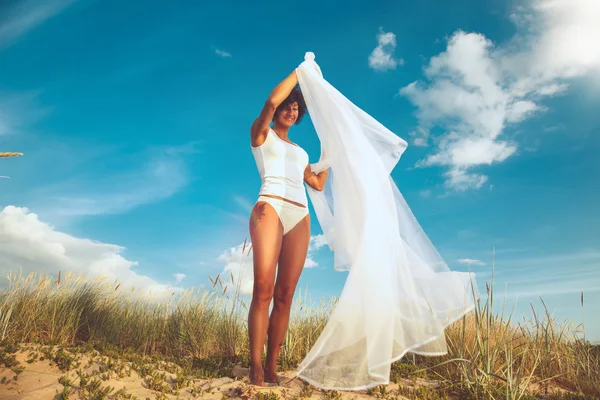 Middle age woman in white bikini. — Stock Photo, Image