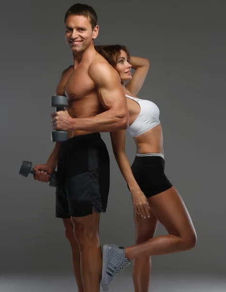 Muscular man and slim woman — Stock Photo, Image