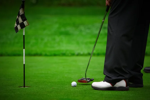 Legs and ball of golf Royalty Free Stock Photos